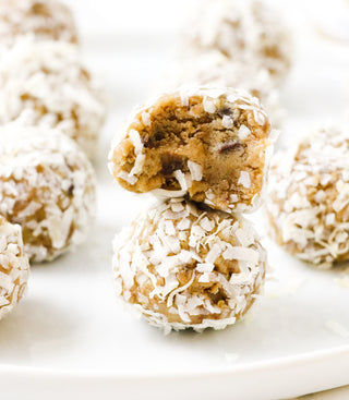 edible chocolate chunk cookie dough rolled in coconut