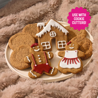 Decorated gingerbread cookies and gingerbread house made with Sweet Loren's Gingerbread Cookie Dough
