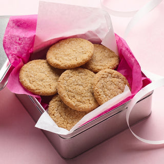 Baked Sweet Loren's Sugar cookies in a gift tin with pink tissue paper