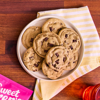 Bowl of baked Sweet Loren's Chocolate Chunk cookies on a striped napkin